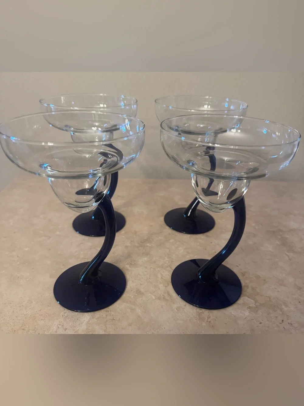 Set of 4 Curved-Stem Clear Coupe Glasses with Blue Stems